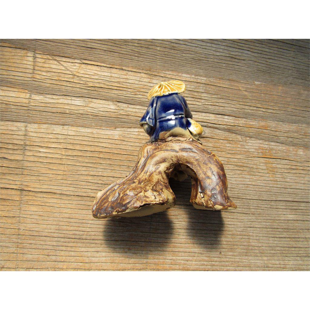 Fisherman Sitting On A Log Ceramic Figurine