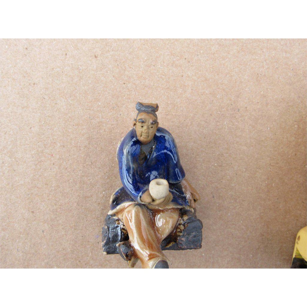 Man Holding A Tea Cup Ceramic Figurine