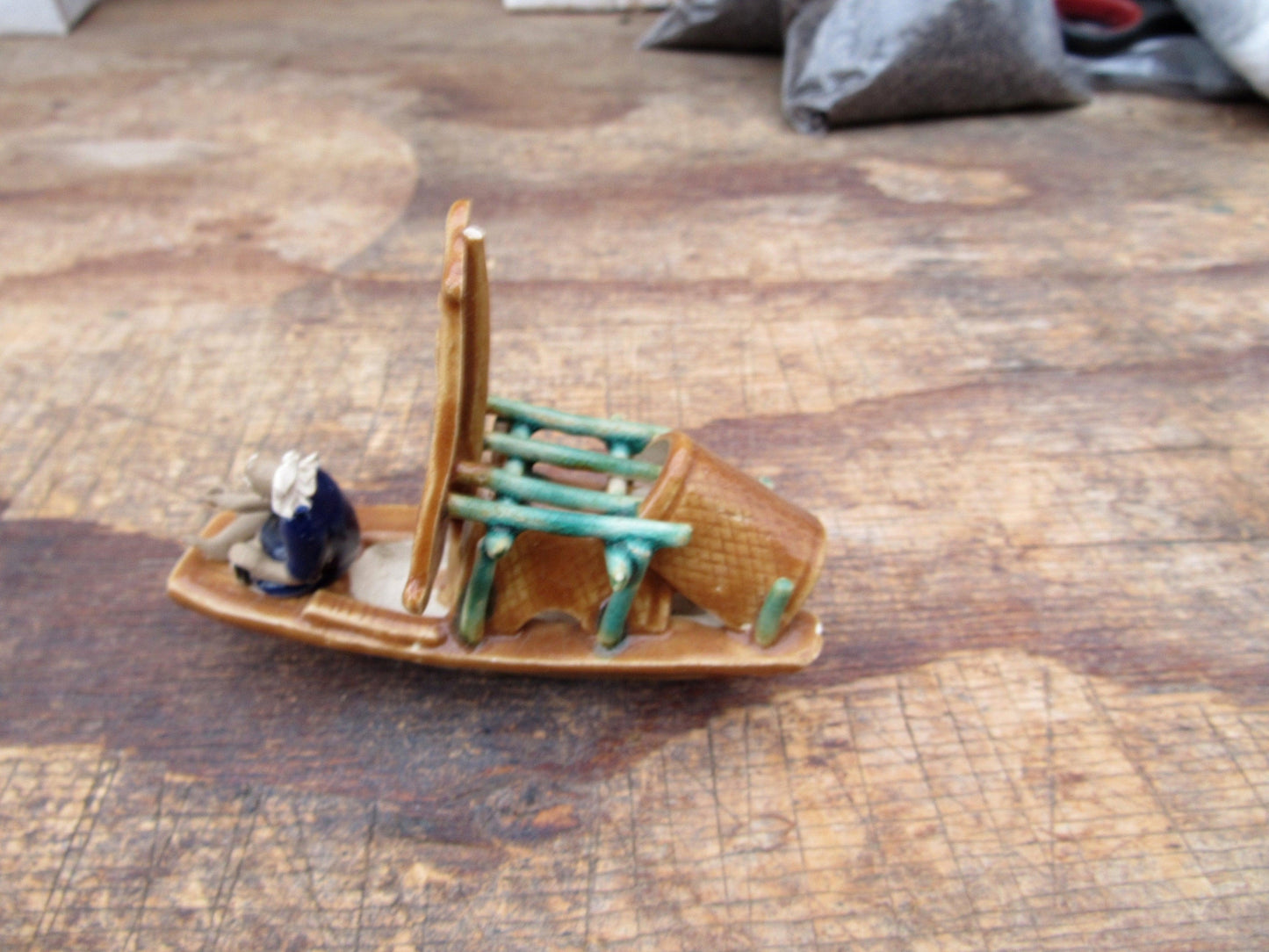 Man on a Large Sampan Boat Figurine