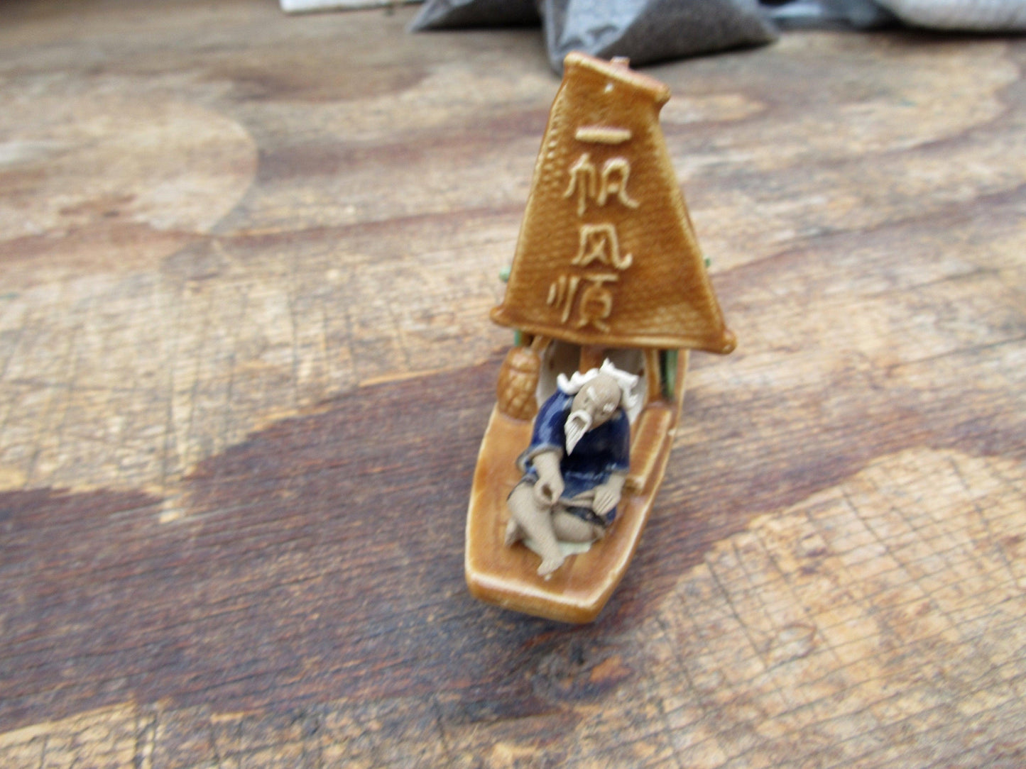 Man on a Large Sampan Boat Figurine