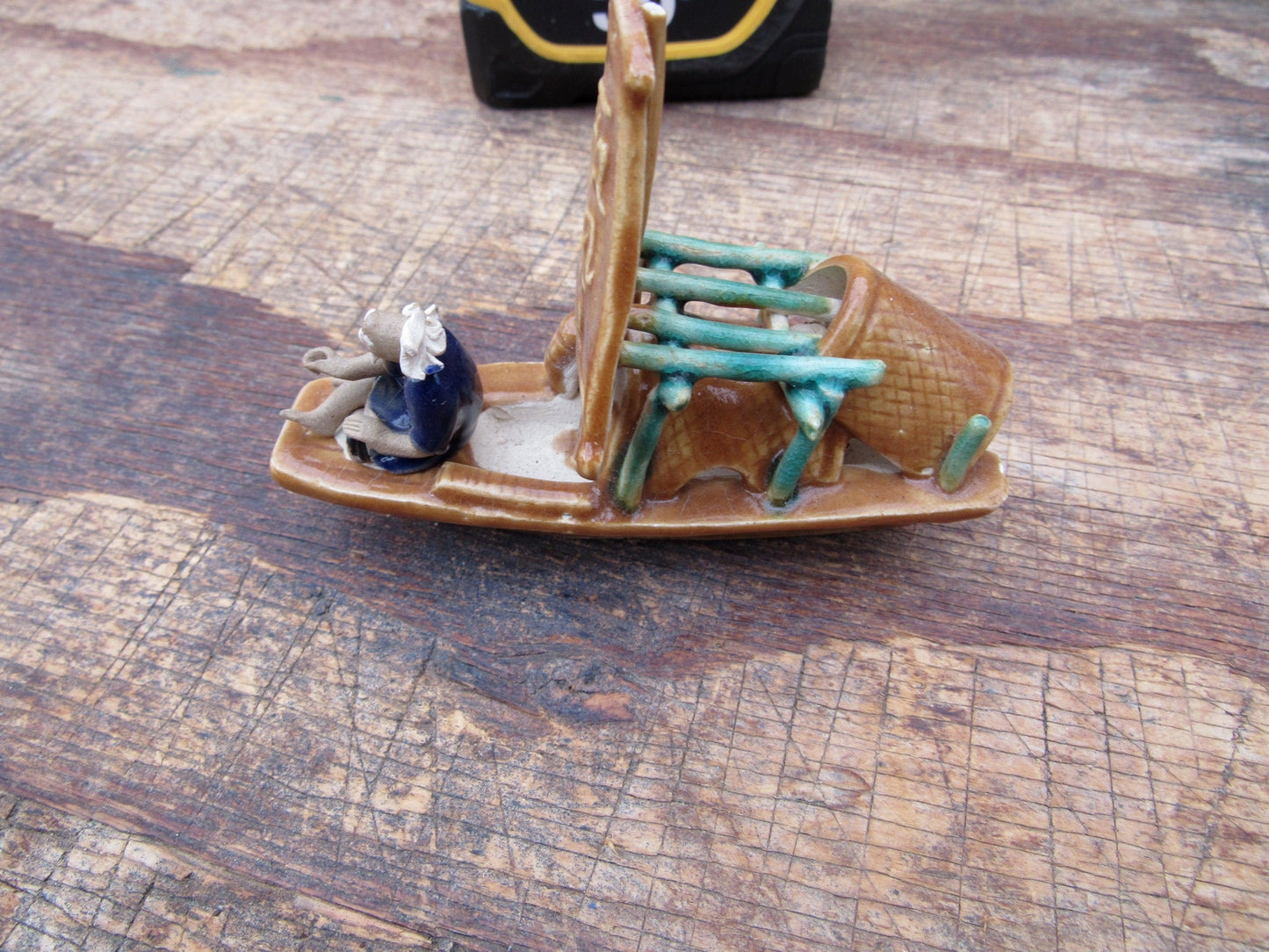 Man on a Large Sampan Boat Figurine