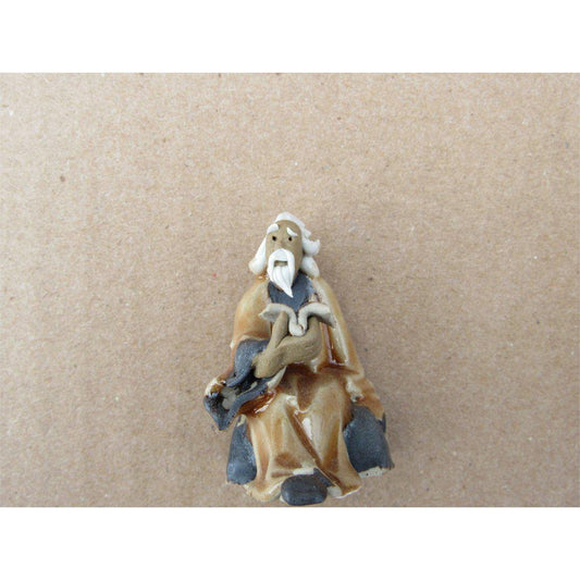 Old Man Reading A Book Ceramic Figurine