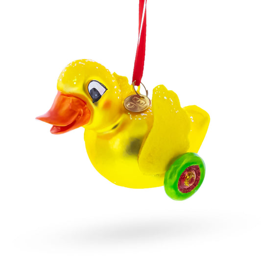 Yellow Duck Rolling on Wheels Blown Glass Christmas Ornament