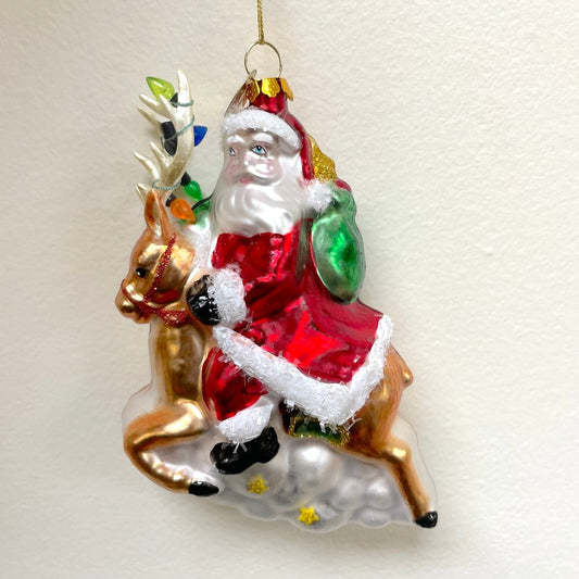 Santa Riding Reindeer Glass Christmas Ornament