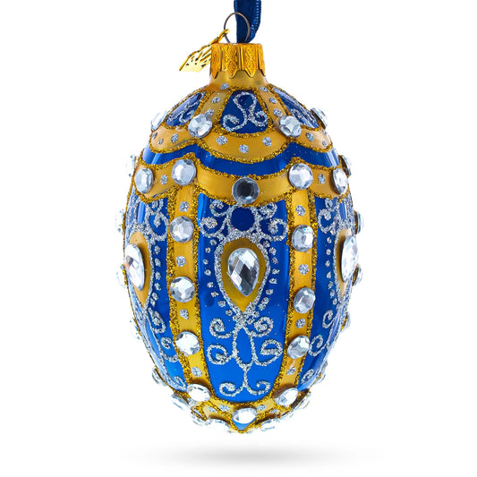 White Scrolls on Blue Glass Egg Ornament 4 Inches